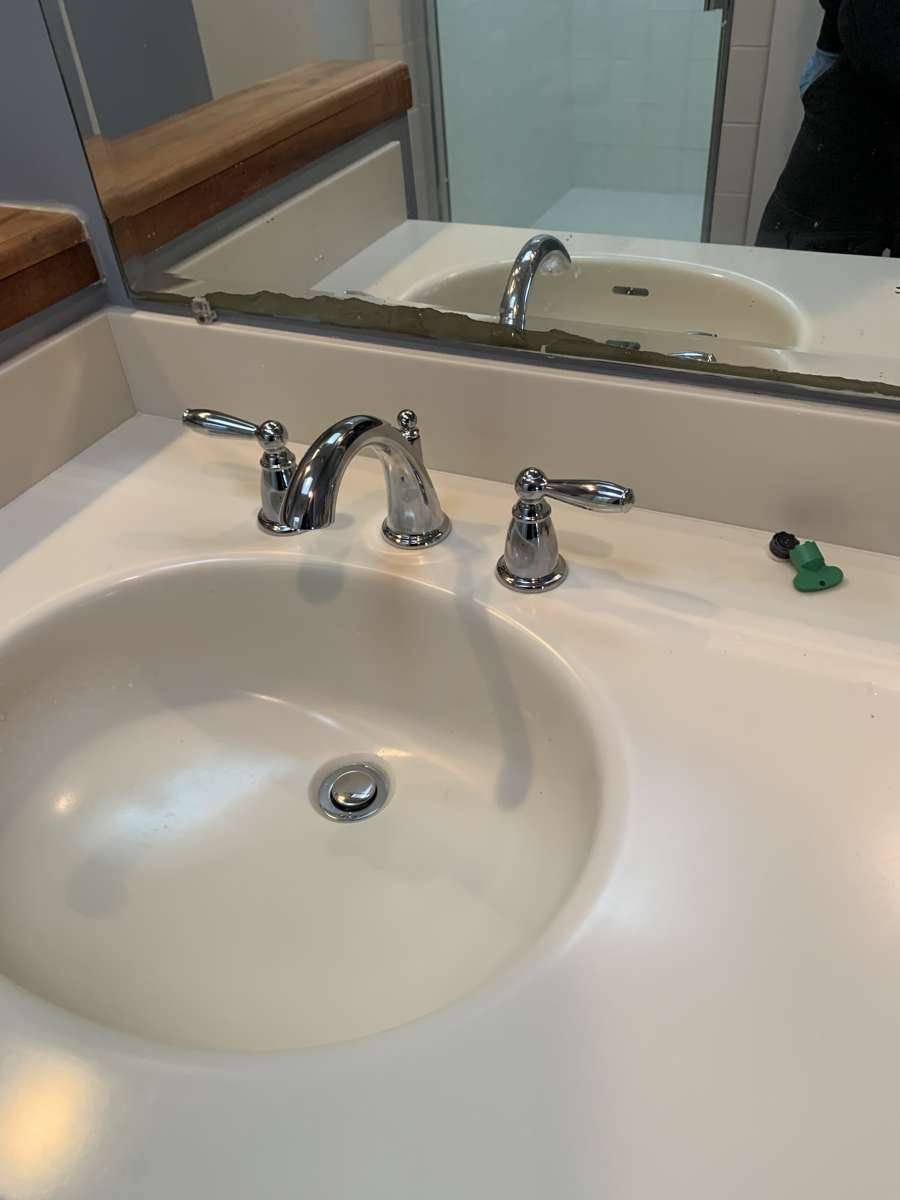 New chrome widespread faucet on a bathroom vanity