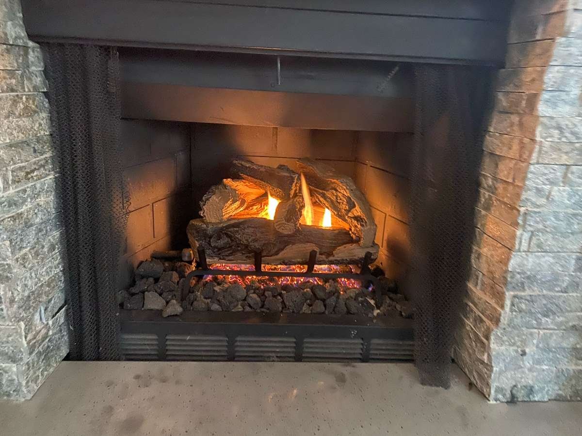 Gas log fireplace burning after gas line service