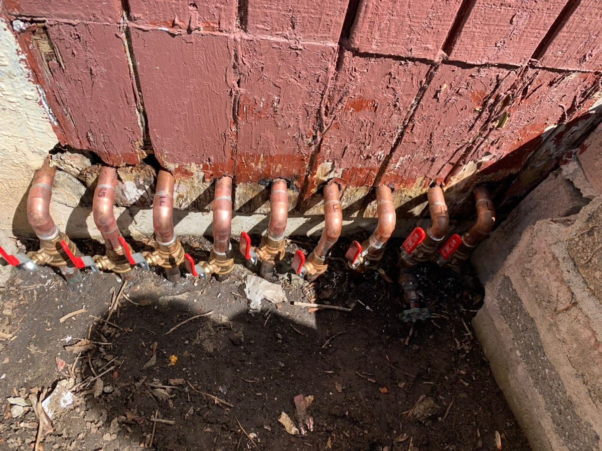 Row of new copper supply stub-outs with shut-off valves