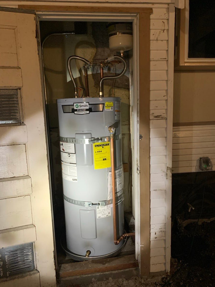 Tank water heater in an exterior closet