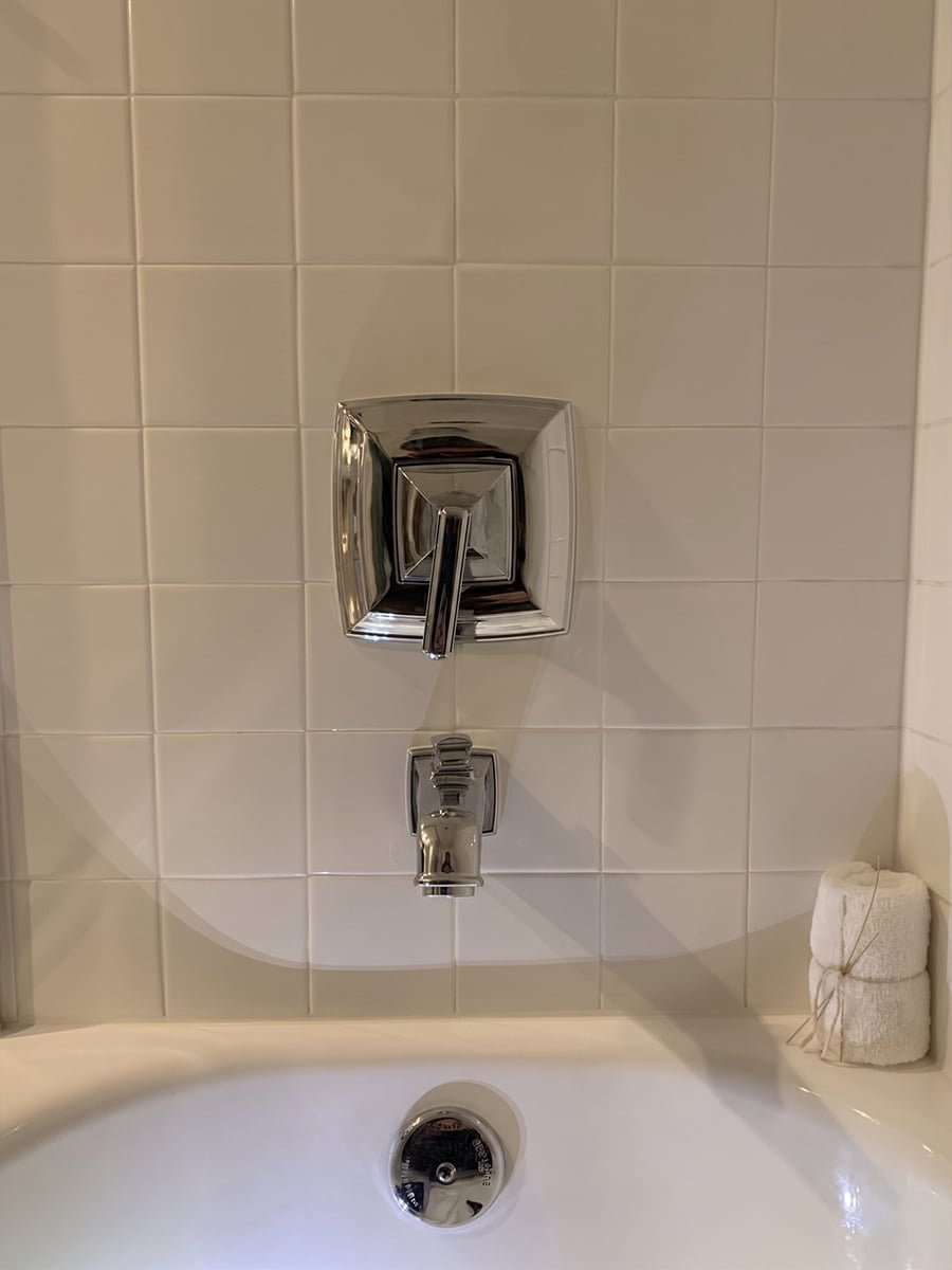 New chrome tub and shower valve trim